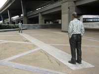 A sculpture of two men facing each other near Paddington Central