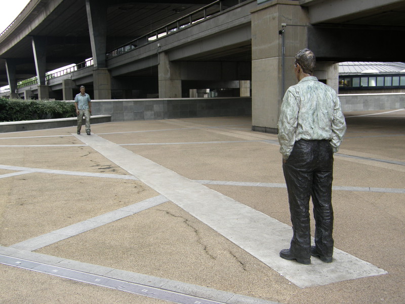 A sculpture of two men facing each other near Paddington Central