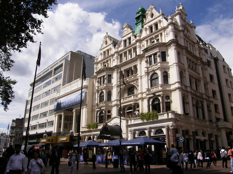 The 19th-century Queen's House (right) and the Empire Theatre (left) on the north side of Leicester Square